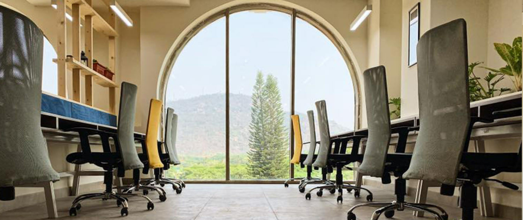 Collaborative workspace at SproutBox Mysore with comfortable seating and open design.